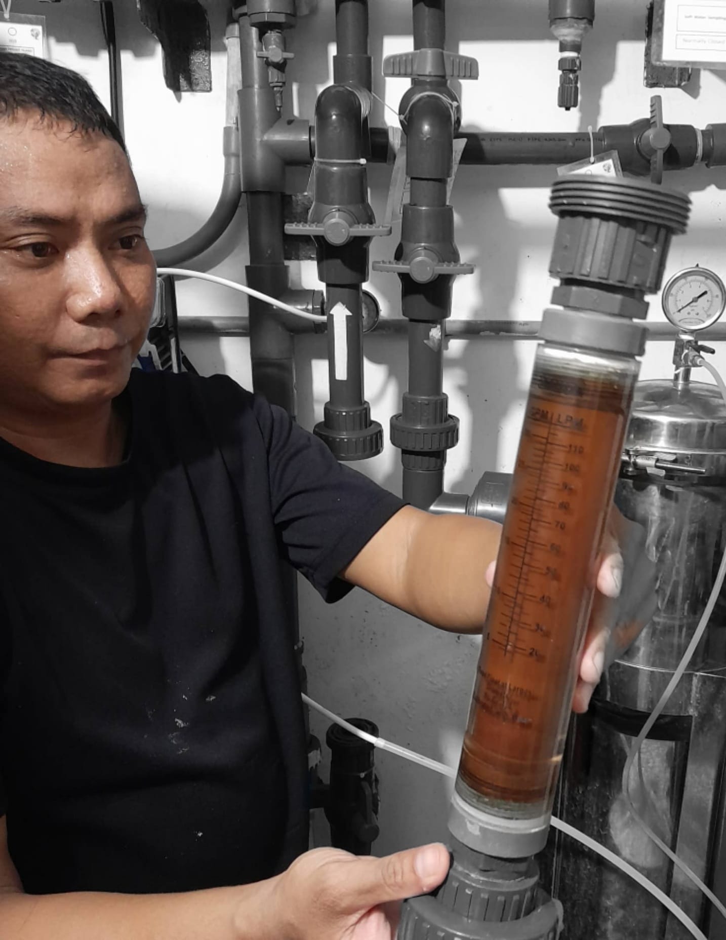 Lush green landscape with a clear stream, symbolizing eco-friendly water management.